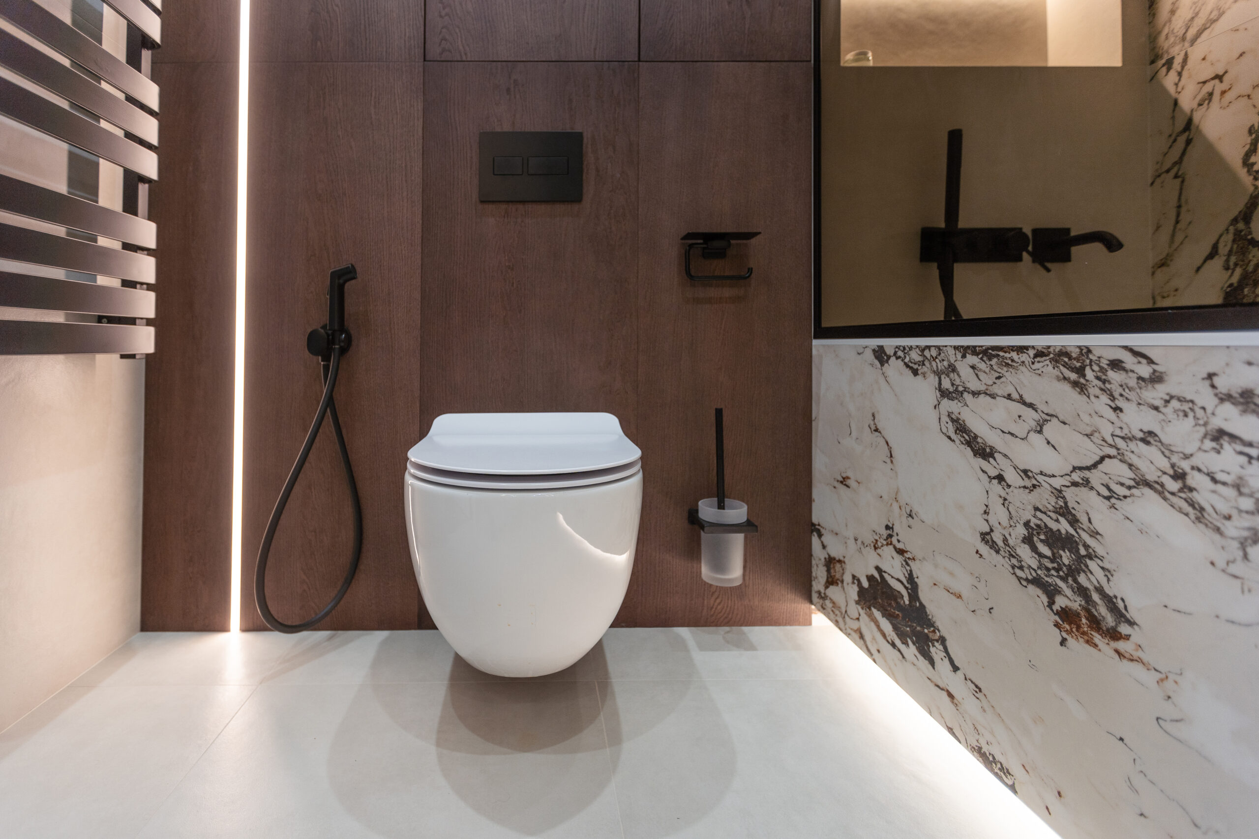 wall hung toilet. white toilet on a gray wall. on the floor tiles imitate wood.